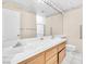 Bathroom features double sink vanity with a large mirror at 1951 Moyer Dr, Henderson, NV 89074