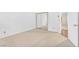 Bright bedroom featuring mirrored closet doors and neutral carpeting at 1951 Moyer Dr, Henderson, NV 89074