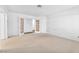 Spacious bedroom with glass paneled doors, and neutral carpet at 1951 Moyer Dr, Henderson, NV 89074
