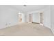 Expansive carpeted bedroom with glass panel doors that create an open feel at 1951 Moyer Dr, Henderson, NV 89074