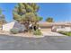 Charming single-story home featuring a low-pitched tile roof, desert landscaping, and a two-car garage at 1951 Moyer Dr, Henderson, NV 89074