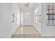 Bright foyer features tiled flooring, a large window, and neutral wall colors, creating a welcoming entrance at 1951 Moyer Dr, Henderson, NV 89074