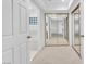 Hallway with mirrored closet doors leads to the bathroom and other rooms at 1951 Moyer Dr, Henderson, NV 89074