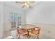 Bright breakfast nook featuring an intricate glass top table with seating for four at 1951 Moyer Dr, Henderson, NV 89074