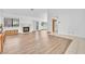 Spacious living room with hardwood flooring, a fireplace, and access to the kitchen at 1951 Moyer Dr, Henderson, NV 89074