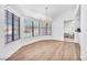 Sun-filled living room with hardwood floors, a chandelier, and oversized windows at 1951 Moyer Dr, Henderson, NV 89074