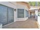 Tiled patio area with access to the home and a lattice privacy screen at 1951 Moyer Dr, Henderson, NV 89074
