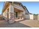 Back patio with decorative stone pillars, brick pavers, and low-maintenance gravel, perfect for outdoor enjoyment at 208 Coltrane Canyon Ave, Henderson, NV 89011