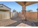 Enclosed backyard area featuring a mix of gravel and brick pavers, offering a private outdoor space at 208 Coltrane Canyon Ave, Henderson, NV 89011