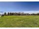 Expansive green lawn and clubhouse, offering ample space for recreation and community events at 208 Coltrane Canyon Ave, Henderson, NV 89011