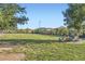 Spacious dog park with lush green grass, seating, and secure fencing at 208 Coltrane Canyon Ave, Henderson, NV 89011