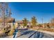 Inviting community entrance with elegant signage and manicured landscaping at 208 Coltrane Canyon Ave, Henderson, NV 89011