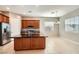 Stylish kitchen featuring stainless steel appliances, a large island, and ample cabinet space at 208 Coltrane Canyon Ave, Henderson, NV 89011