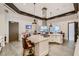 Bright open kitchen boasts stainless hood, spacious island and modern finishes at 208 Coltrane Canyon Ave, Henderson, NV 89011