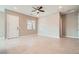 Bright living room with neutral paint, tile flooring, and a ceiling fan at 208 Coltrane Canyon Ave, Henderson, NV 89011
