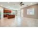 Open-concept living space featuring tile flooring, recessed lighting, and a view of the kitchen area at 208 Coltrane Canyon Ave, Henderson, NV 89011