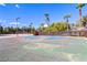 Outdoor basketball court surrounded by palm trees with well-maintained asphalt and vibrant blue and red painted markings at 224 Wicked Wedge Way, Las Vegas, NV 89148