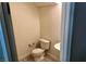 This cozy half-bath includes a toilet, sink, and tile flooring at 224 Wicked Wedge Way, Las Vegas, NV 89148