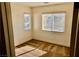 Bright bedroom with carpeted floors and natural light from two windows at 224 Wicked Wedge Way, Las Vegas, NV 89148