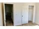 Bedroom with carpeted floors, standard closet, and neutral colored walls at 224 Wicked Wedge Way, Las Vegas, NV 89148