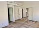 Spacious bedroom featuring neutral carpeting, doors leading to other rooms, and ample natural light at 224 Wicked Wedge Way, Las Vegas, NV 89148