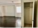 View of closet located near a spacious living room with dark wood floors at 224 Wicked Wedge Way, Las Vegas, NV 89148