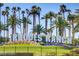 Rhodes Ranch community sign, landscaped with palm trees in the background at 224 Wicked Wedge Way, Las Vegas, NV 89148