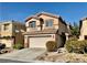 Traditional two-story home with a two car garage and well maintained lawn at 224 Wicked Wedge Way, Las Vegas, NV 89148