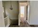 Upstairs hallway and stairway featuring neutral decor and staircase with white wood trim at 224 Wicked Wedge Way, Las Vegas, NV 89148