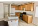 Well-equipped kitchen features a gas range, an island with a breakfast bar, and plenty of counter space at 224 Wicked Wedge Way, Las Vegas, NV 89148