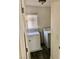 Functional laundry room with a window, including both a washer and dryer for convenience at 224 Wicked Wedge Way, Las Vegas, NV 89148
