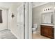 A half bath with a granite vanity and tiled floors at 2333 Mundare Dr, Henderson, NV 89002