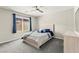 Cozy bedroom with a ceiling fan, window with blinds, and comfortable queen bed at 2333 Mundare Dr, Henderson, NV 89002