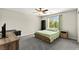 Bedroom featuring a ceiling fan, window, TV, desk, and full-size bed at 2333 Mundare Dr, Henderson, NV 89002