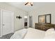 Comfortable bedroom features a ceiling fan, and modern decor elements for a relaxing retreat at 2333 Mundare Dr, Henderson, NV 89002