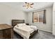 Cozy bedroom with a ceiling fan, window, and carpeted flooring at 2333 Mundare Dr, Henderson, NV 89002