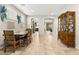 Open dining area featuring a large table, chairs, and a hutch, creating a great space for entertaining at 2333 Mundare Dr, Henderson, NV 89002