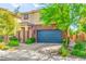Charming two-story home featuring a two-car garage, landscaped front yard, and a cozy covered entry at 2333 Mundare Dr, Henderson, NV 89002