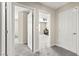 Hallway featuring multiple doorways including an office and other rooms at 2333 Mundare Dr, Henderson, NV 89002