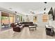 Spacious living room with tile flooring, recessed lighting, and sliding glass doors to the backyard at 2333 Mundare Dr, Henderson, NV 89002