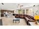Open-concept living area with a modern kitchen, comfortable seating, and abundant natural light at 2333 Mundare Dr, Henderson, NV 89002
