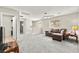 Second-floor loft area with carpet, comfortable sofa, natural light, and ceiling fan at 2333 Mundare Dr, Henderson, NV 89002