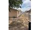 The property features a side yard with a walkway and partial fencing, offering privacy and space at 2450 Oak Glen Way, Las Vegas, NV 89115