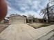Single story house with a two car garage and a long driveway at 2450 Oak Glen Way, Las Vegas, NV 89115