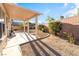 Backyard featuring a covered patio, landscaping, and block wall at 2608 Campobello Ave, North Las Vegas, NV 89081