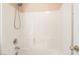 Standard bathtub and shower combo with tiled walls and shower head at 2608 Campobello Ave, North Las Vegas, NV 89081