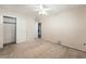 Bedroom showcasing carpet flooring, closet, and ceiling fan with light, offering ample space at 2608 Campobello Ave, North Las Vegas, NV 89081