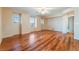Bright bedroom with hardwood floors, ceiling fan, and natural light from multiple windows at 2608 Campobello Ave, North Las Vegas, NV 89081