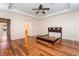 The main bedroom features a tray ceiling, laminate flooring, and neutral paint at 2608 Campobello Ave, North Las Vegas, NV 89081