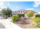 Inviting two-story home with a manicured front yard and a convenient two-car garage at 2608 Campobello Ave, North Las Vegas, NV 89081